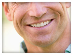 Man Smiling With Dental Implants